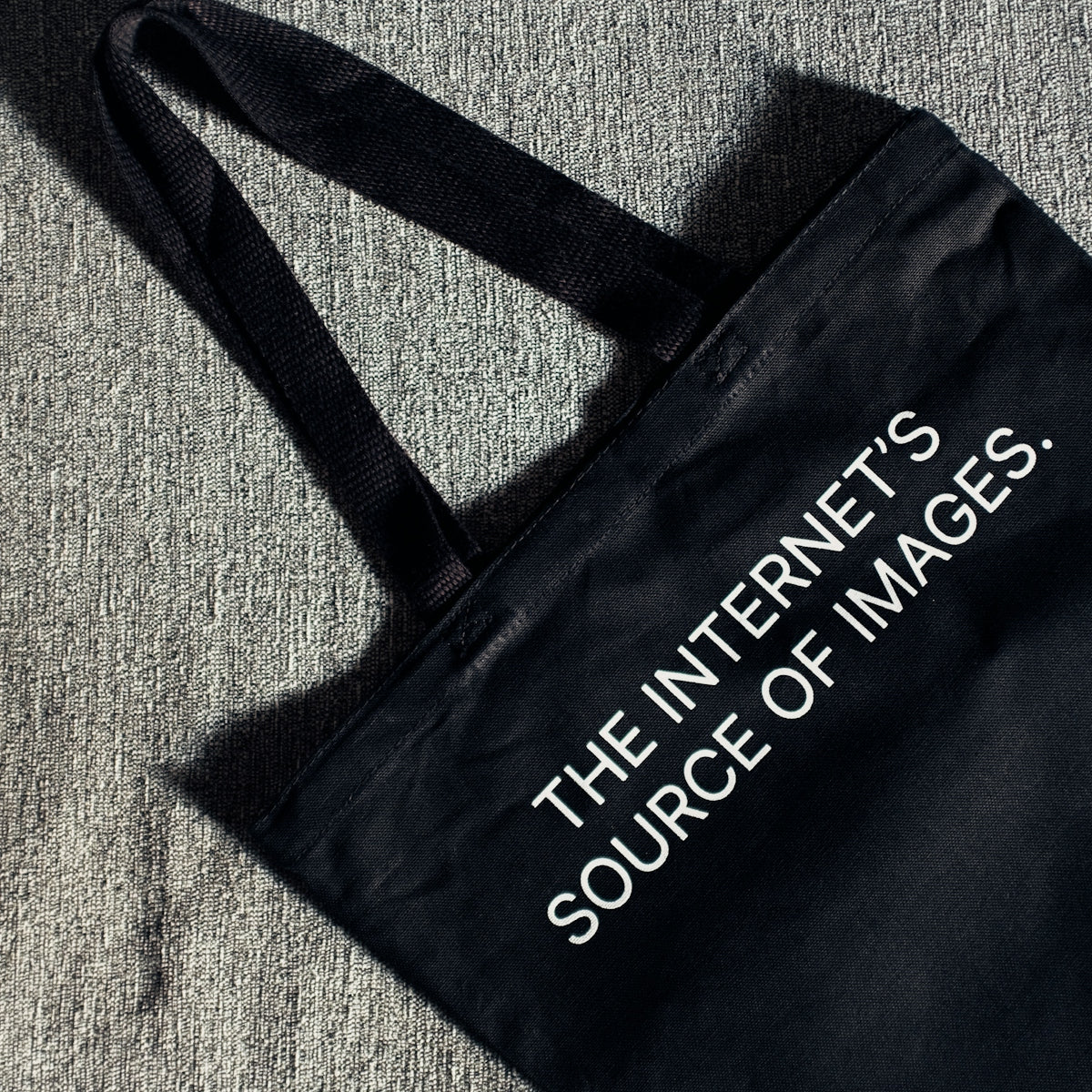a black bag with the words the internet is source of images printed on it