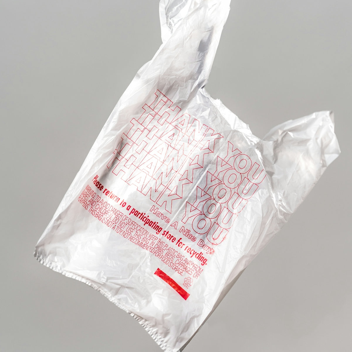 white plastic bag on white table