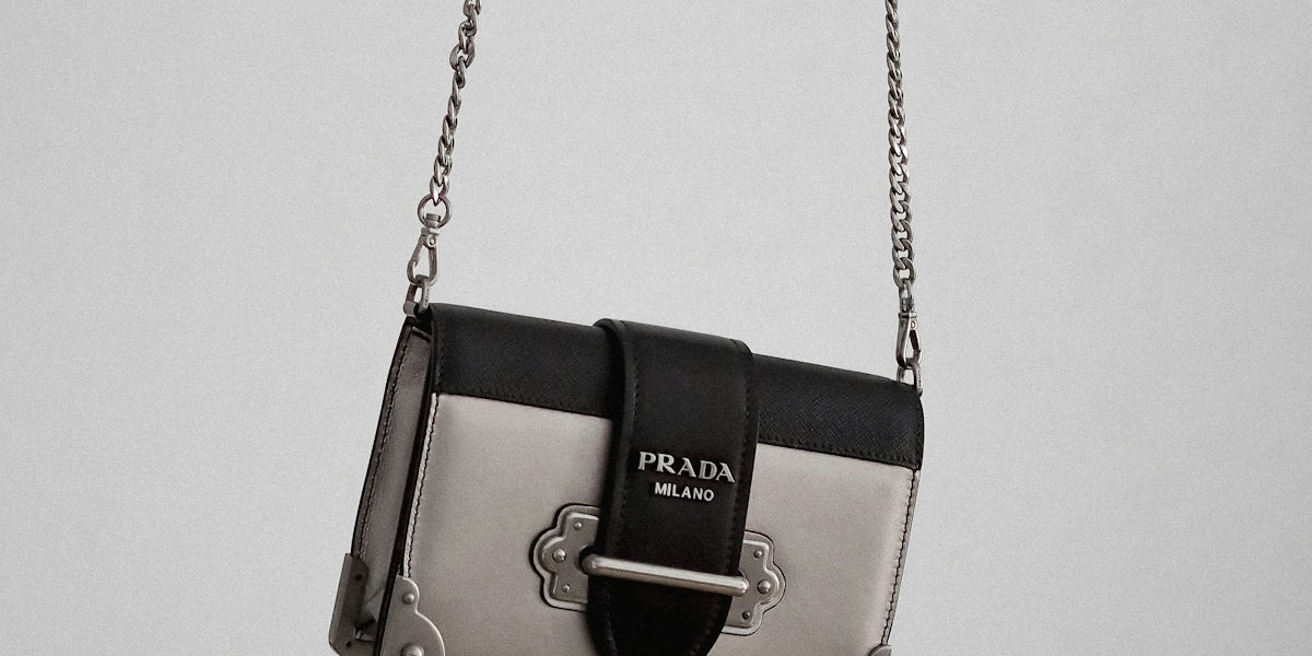 brown and black leather sling bag