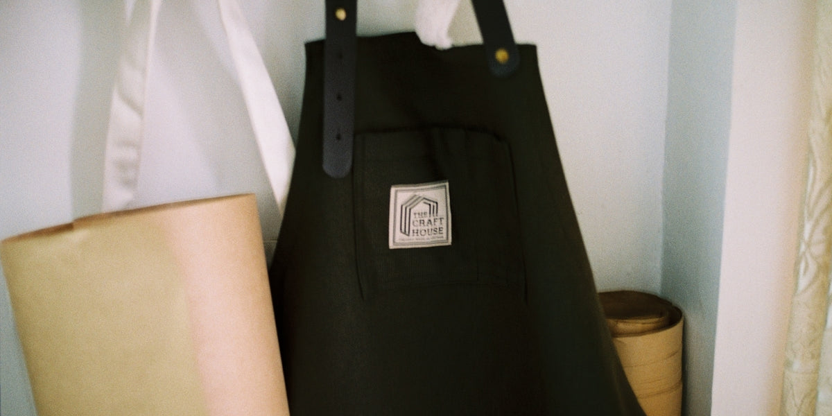 a black bag sitting on top of a shelf next to a lamp