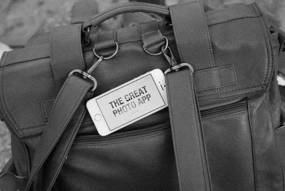 a black and white photo of a bag with a tag on it