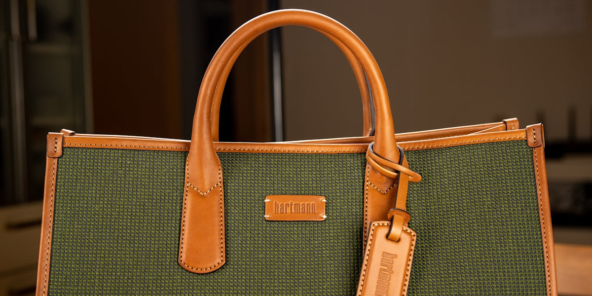 a brown handbag with a handle