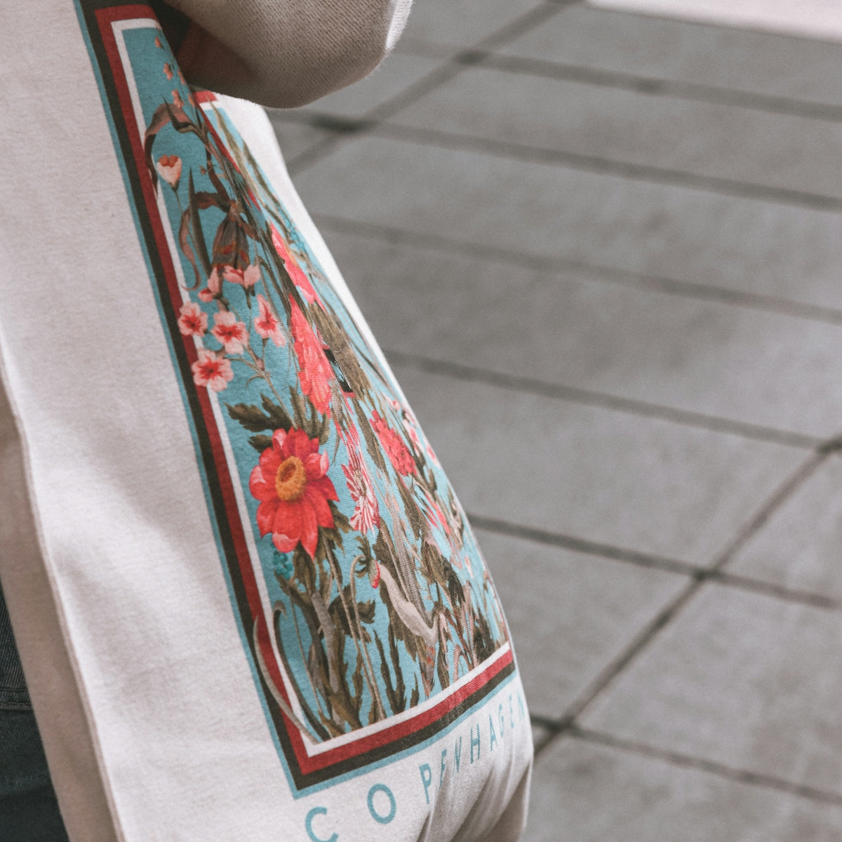 a close up of a person holding a bag