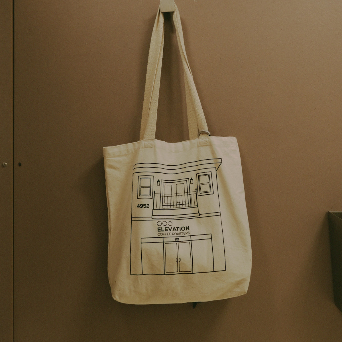 a canvas bag hanging on a wall