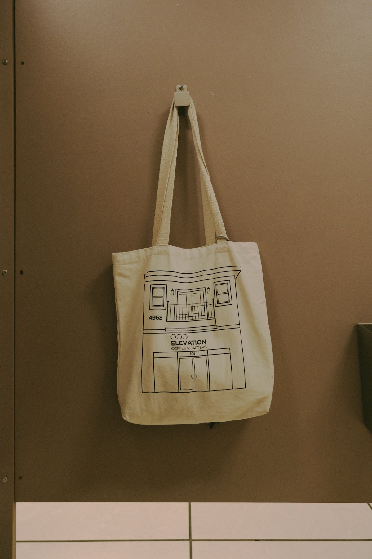 a canvas bag hanging on a wall