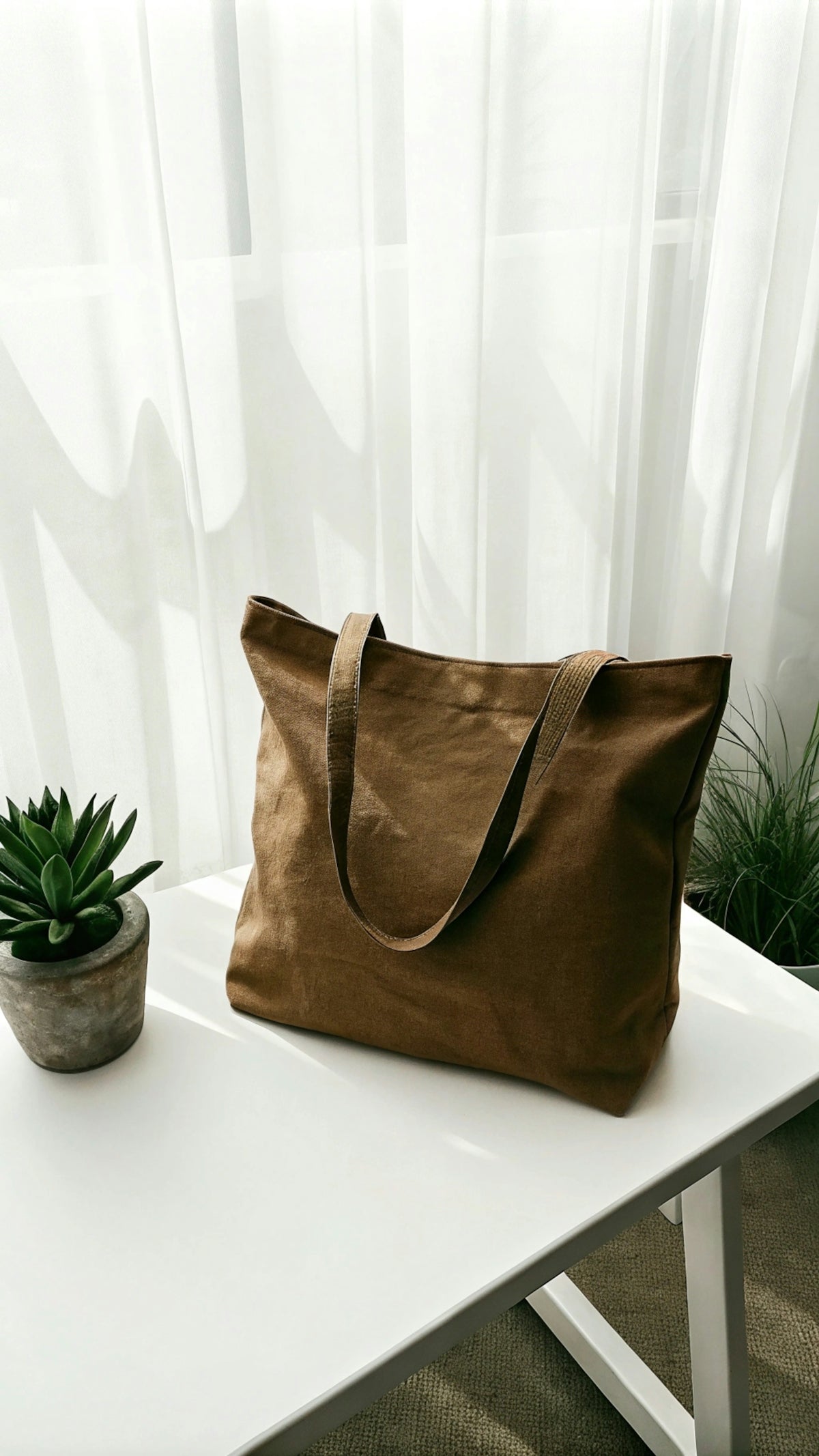 A brown bag sitting on top of a white table