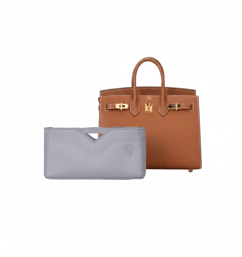 Luxury tan handbag with eco-friendly gray inner bag organizer on white background