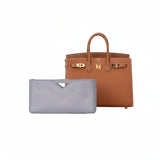 Luxury tan handbag with eco-friendly gray inner bag organizer on white background